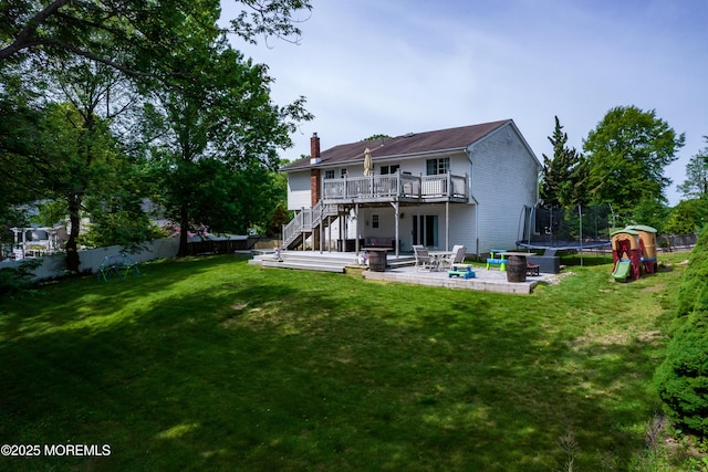 20 Koosman Dr, Leonardo, NJ 07737 - back of property featuring a trampoline, stairway, a wooden deck, a patio area, and a chimney