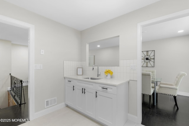 5 S Dakota Ave, Jackson, NJ 08527 - kitchen featuring a sink, white cabinets, light countertops, baseboards, and recessed lighting