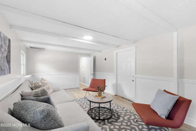 5 S Dakota Ave, Jackson, NJ 08527 - living room with a wainscoted wall, light wood-type flooring, and beam ceiling