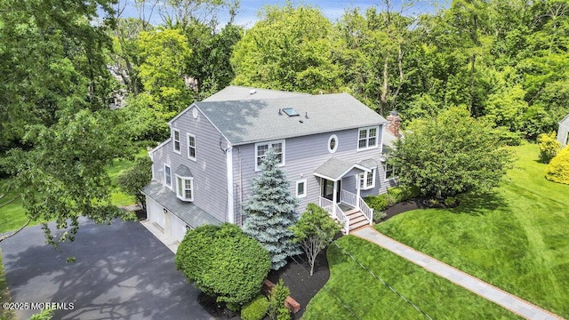 71 Maple Ave, Little Silver, NJ 07739 - view of front of home featuring a garage, a chimney, a shingled roof, asphalt driveway, and a front lawn