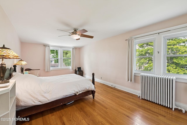 228 Albert Pl, Elberon, NJ 07740 - bedroom with radiator heating unit, wood finished floors, multiple windows, and baseboards