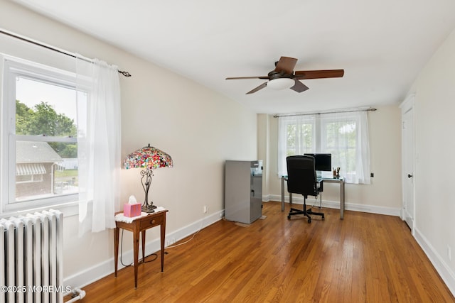 228 Albert Pl, Elberon, NJ 07740 - office featuring radiator heating unit, a ceiling fan, wood finished floors, and baseboards