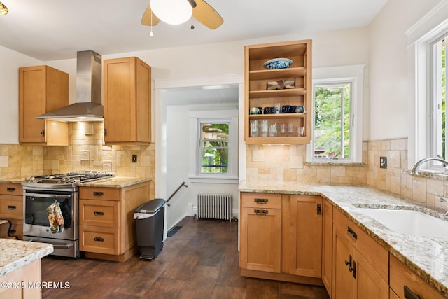 228 Albert Pl, Elberon, NJ 07740 - kitchen featuring radiator, stainless steel gas range, wall chimney exhaust hood, a sink, and light stone countertops