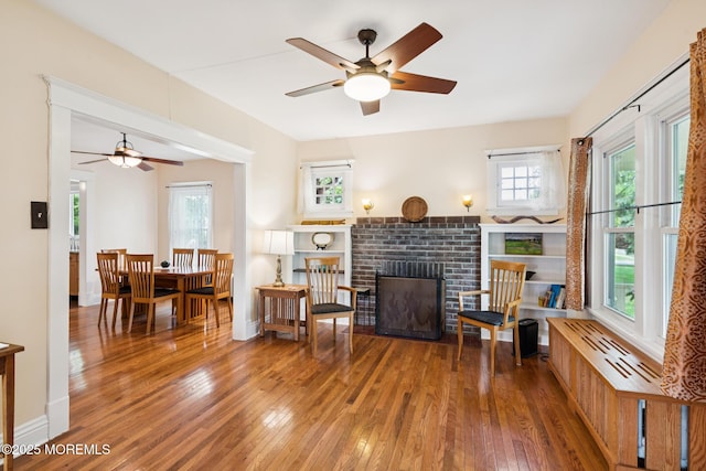 228 Albert Pl, Elberon, NJ 07740 - living room with ceiling fan, hardwood / wood-style floors, a brick fireplace, and healthy amount of natural light