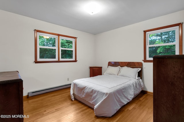 9 Riccis Dr, Jackson, NJ 08527 - bedroom featuring a baseboard radiator, light wood-type flooring, and baseboards