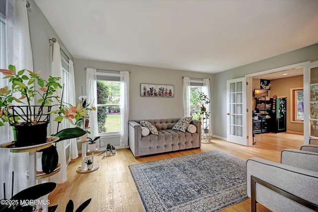 2 Hampton Hollow Dr, Perrineville, NJ 08535 - living area with french doors, light wood-style flooring, and baseboards