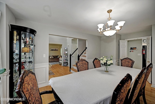 2 Hampton Hollow Dr, Perrineville, NJ 08535 - dining room featuring stairway, a chandelier, and light wood-type flooring