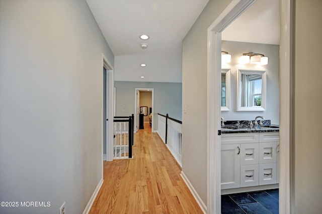 2 Hampton Hollow Dr, Perrineville, NJ 08535 - corridor featuring a sink, an upstairs landing, light wood finished floors, recessed lighting, and baseboards