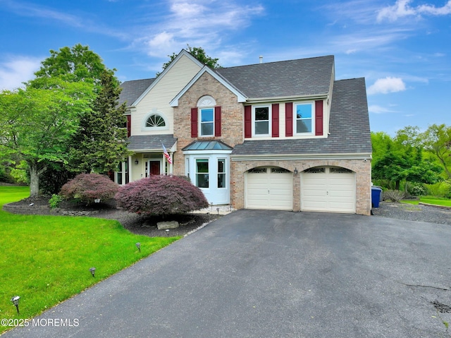 2 Hampton Hollow Dr, Perrineville, NJ 08535 - traditional-style home featuring asphalt driveway, a garage, a shingled roof, and a front yard