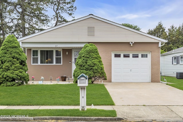 87 Prince Charles Dr, Toms River, NJ 08757 - view of front of property with concrete driveway, brick siding, and a front yard