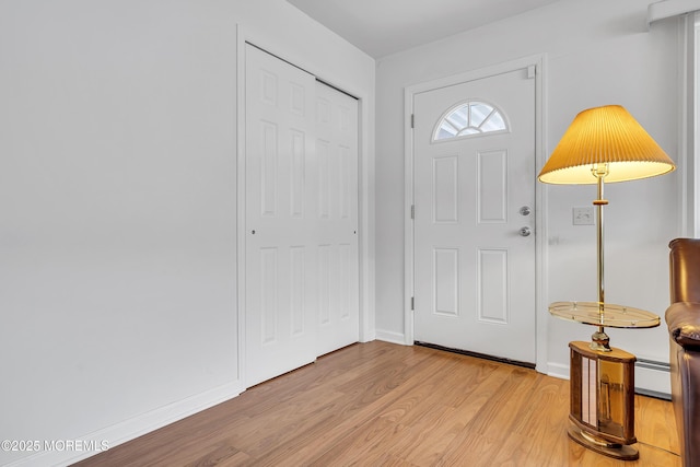 87 Prince Charles Dr, Toms River, NJ 08757 - foyer with light wood-style flooring, a baseboard heating unit, and baseboards