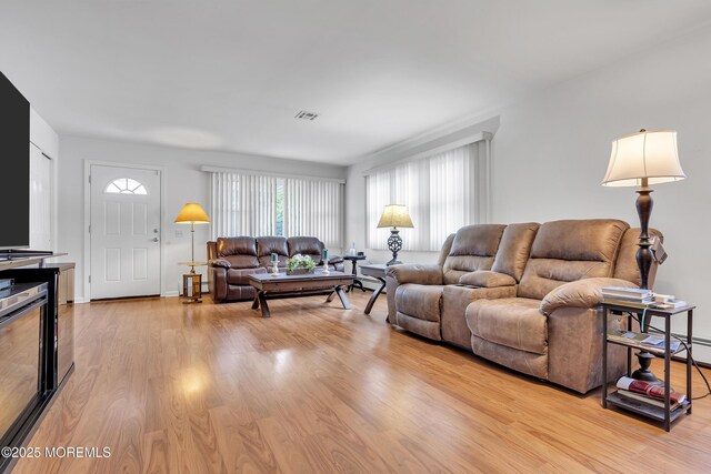 87 Prince Charles Dr, Toms River, NJ 08757 - living area featuring light wood-type flooring and baseboards