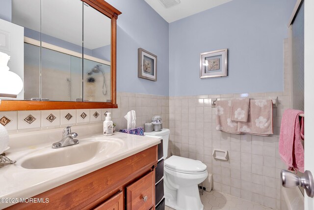 87 Prince Charles Dr, Toms River, NJ 08757 - full bath featuring vanity, toilet, tile walls, a shower stall, and tile patterned floors