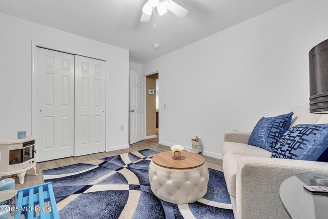 87 Prince Charles Dr, Toms River, NJ 08757 - living area featuring wood finished floors, a ceiling fan, and baseboards
