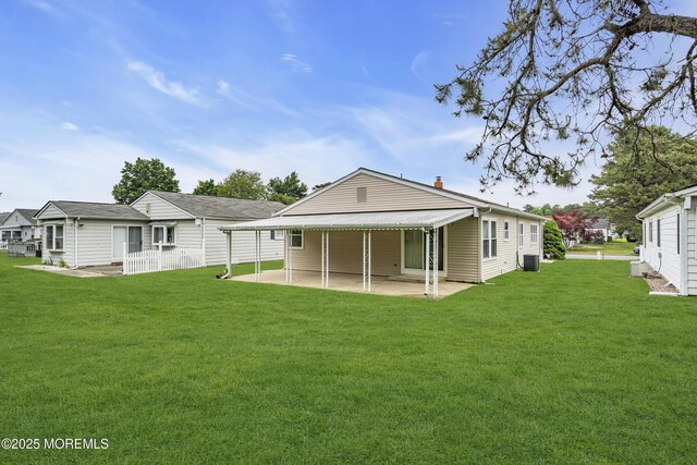 87 Prince Charles Dr, Toms River, NJ 08757 - rear view of house featuring a patio area, a yard, and central AC