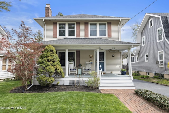83 Lake Ave, Fair Haven, NJ 07704 - american foursquare style home featuring covered porch, a chimney, a front yard, and cooling unit