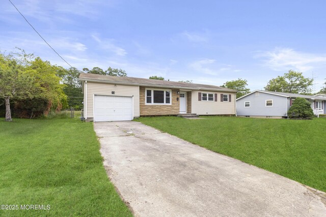 23 Drexel Dr, Jackson, NJ 08527 - ranch-style house with concrete driveway, an attached garage, and a front yard