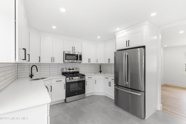 23 Drexel Dr, Jackson, NJ 08527 - kitchen featuring stainless steel appliances, a sink, light countertops, white cabinetry, and recessed lighting