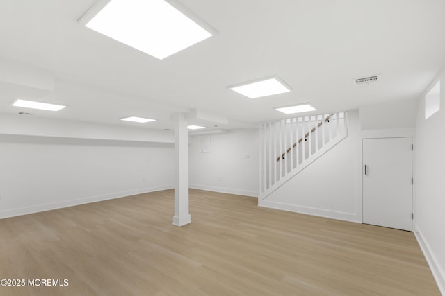 23 Drexel Dr, Jackson, NJ 08527 - finished basement featuring light wood-style flooring, stairway, and baseboards