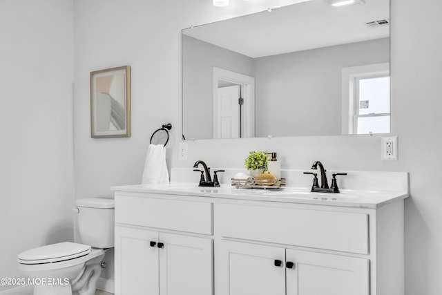 231 Cedar Island Dr, Brick, NJ 08723 - bathroom featuring double vanity and toilet