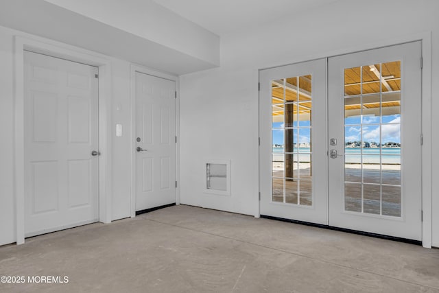 231 Cedar Island Dr, Brick, NJ 08723 - foyer with french doors and concrete flooring