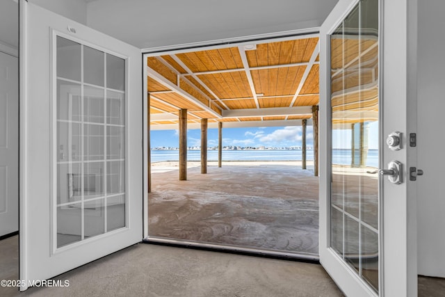 231 Cedar Island Dr, Brick, NJ 08723 - entryway with a water view, plenty of natural light, carpet floors, and wood ceiling