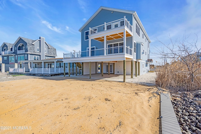 231 Cedar Island Dr, Brick, NJ 08723 - rear view of property featuring a balcony, a patio, and a wooden deck