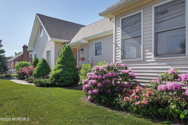 146 Morningside Ave, Union Beach, NJ 07735 - view of home's exterior featuring a yard and roof with shingles