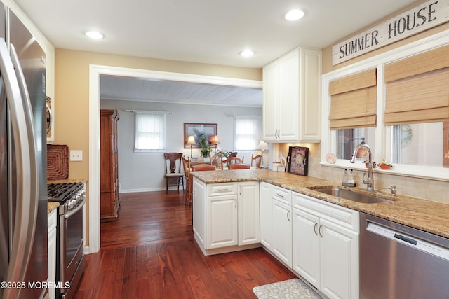 146 Morningside Ave, Union Beach, NJ 07735 - kitchen with appliances with stainless steel finishes, a sink, dark wood finished floors, white cabinets, and recessed lighting