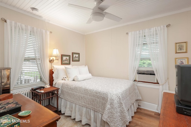 146 Morningside Ave, Union Beach, NJ 07735 - bedroom featuring crown molding, wood finished floors, a ceiling fan, cooling unit, and baseboards