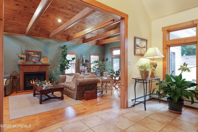 146 Morningside Ave, Union Beach, NJ 07735 - living area with healthy amount of natural light, wood ceiling, a glass covered fireplace, a baseboard heating unit, and light wood-style floors