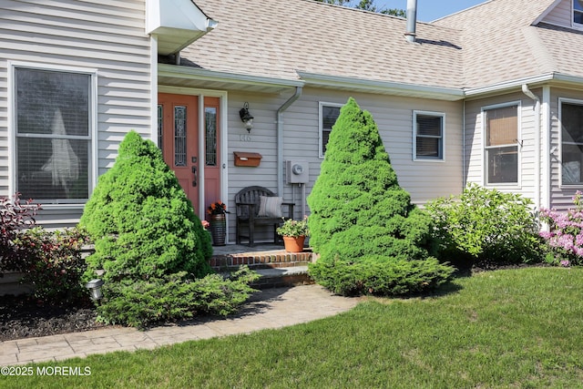 146 Morningside Ave, Union Beach, NJ 07735 - property entrance with a shingled roof and a yard