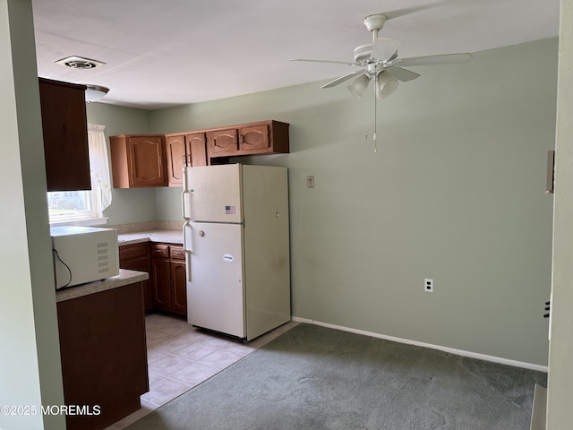 146B Hudson Pkwy, Whiting, NJ 08759 - kitchen with white appliances, a ceiling fan, light countertops, and light tile patterned floors