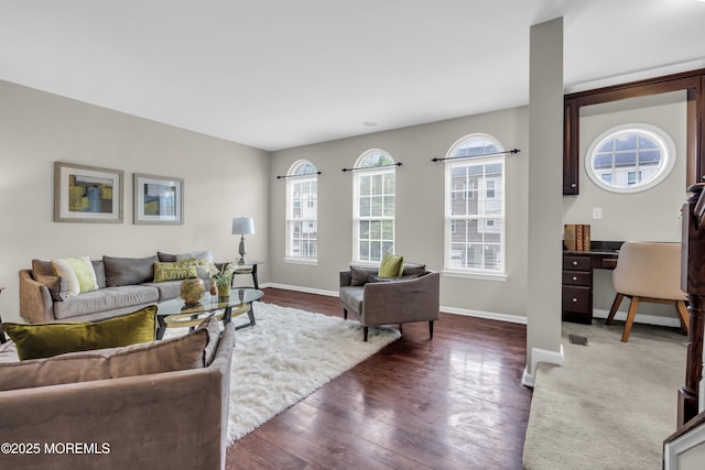 52 Pate Dr, Middletown, NJ 07748 - living room with dark wood-style floors and baseboards