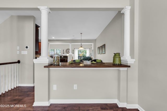 52 Pate Dr, Middletown, NJ 07748 - kitchen with ornate columns, dark wood-style floors, hanging light fixtures, and baseboards