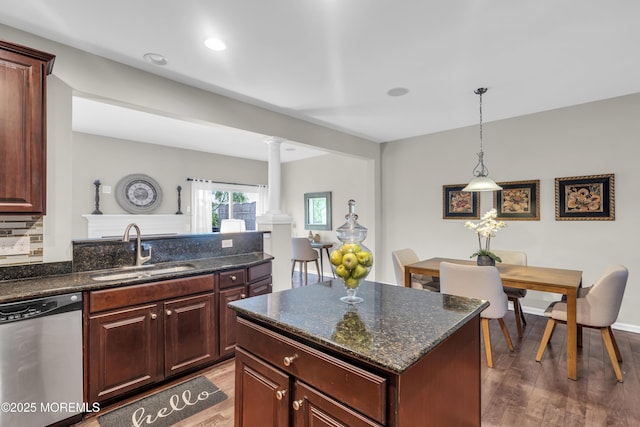 52 Pate Dr, Middletown, NJ 07748 - kitchen featuring dishwasher, a sink, ornate columns, light wood-style floors, and pendant lighting