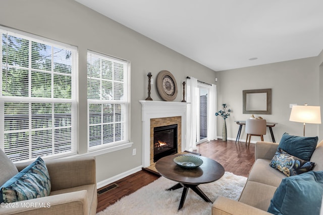 52 Pate Dr, Middletown, NJ 07748 - living area featuring a glass covered fireplace, wood finished floors, and baseboards