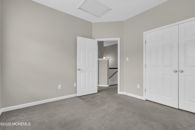 52 Pate Dr, Middletown, NJ 07748 - unfurnished bedroom featuring carpet floors, baseboards, attic access, and a closet