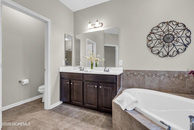 52 Pate Dr, Middletown, NJ 07748 - bathroom featuring a garden tub, double vanity, toilet, and baseboards