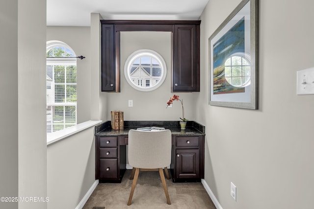 52 Pate Dr, Middletown, NJ 07748 - home office with light carpet, built in desk, and baseboards
