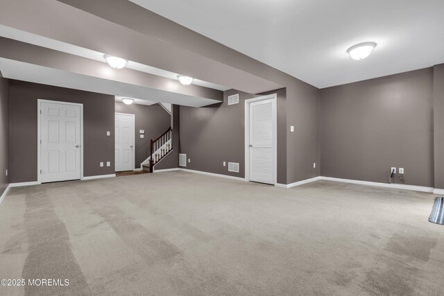 52 Pate Dr, Middletown, NJ 07748 - below grade area with baseboards, stairway, and light carpet