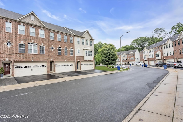 52 Pate Dr, Middletown, NJ 07748 - view of asphalt street with street lights, a residential view, sidewalks, and curbs