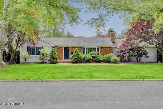 635 Susan Ln, Brielle, NJ 08730 - ranch-style house featuring a front lawn and a chimney