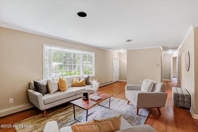 635 Susan Ln, Brielle, NJ 08730 - living room featuring crown molding, baseboard heating, baseboards, and wood finished floors