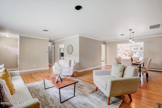 635 Susan Ln, Brielle, NJ 08730 - living room featuring light wood finished floors, baseboards, a baseboard radiator, ornamental molding, and a baseboard heating unit