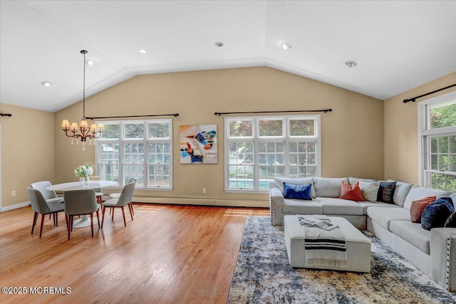 635 Susan Ln, Brielle, NJ 08730 - living room featuring a chandelier, wood finished floors, vaulted ceiling, and baseboards