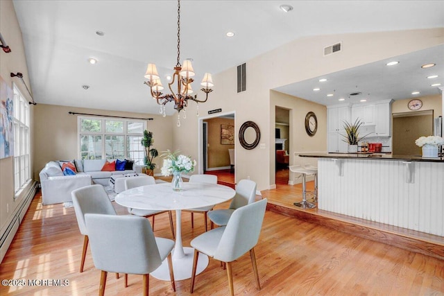 635 Susan Ln, Brielle, NJ 08730 - dining area featuring lofted ceiling, a chandelier, light wood-type flooring, a baseboard heating unit, and recessed lighting