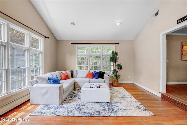 635 Susan Ln, Brielle, NJ 08730 - living room with lofted ceiling, baseboard heating, wood finished floors, baseboards, and recessed lighting