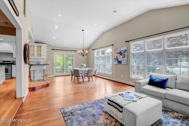 635 Susan Ln, Brielle, NJ 08730 - living room with lofted ceiling, a chandelier, light wood-style floors, a baseboard radiator, and recessed lighting
