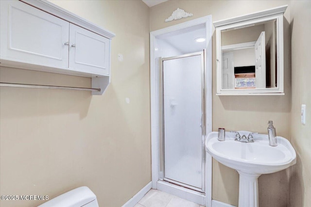 635 Susan Ln, Brielle, NJ 08730 - bathroom featuring a stall shower, toilet, baseboards, and tile patterned flooring